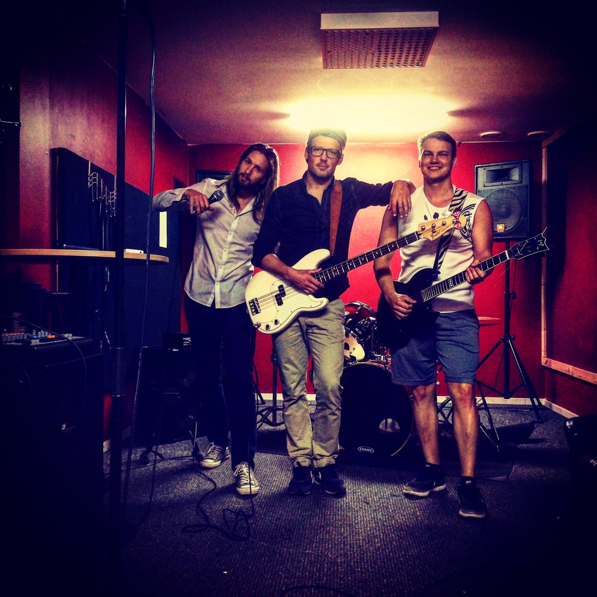 Trip Sixteen members in the rehearsal room with guitars